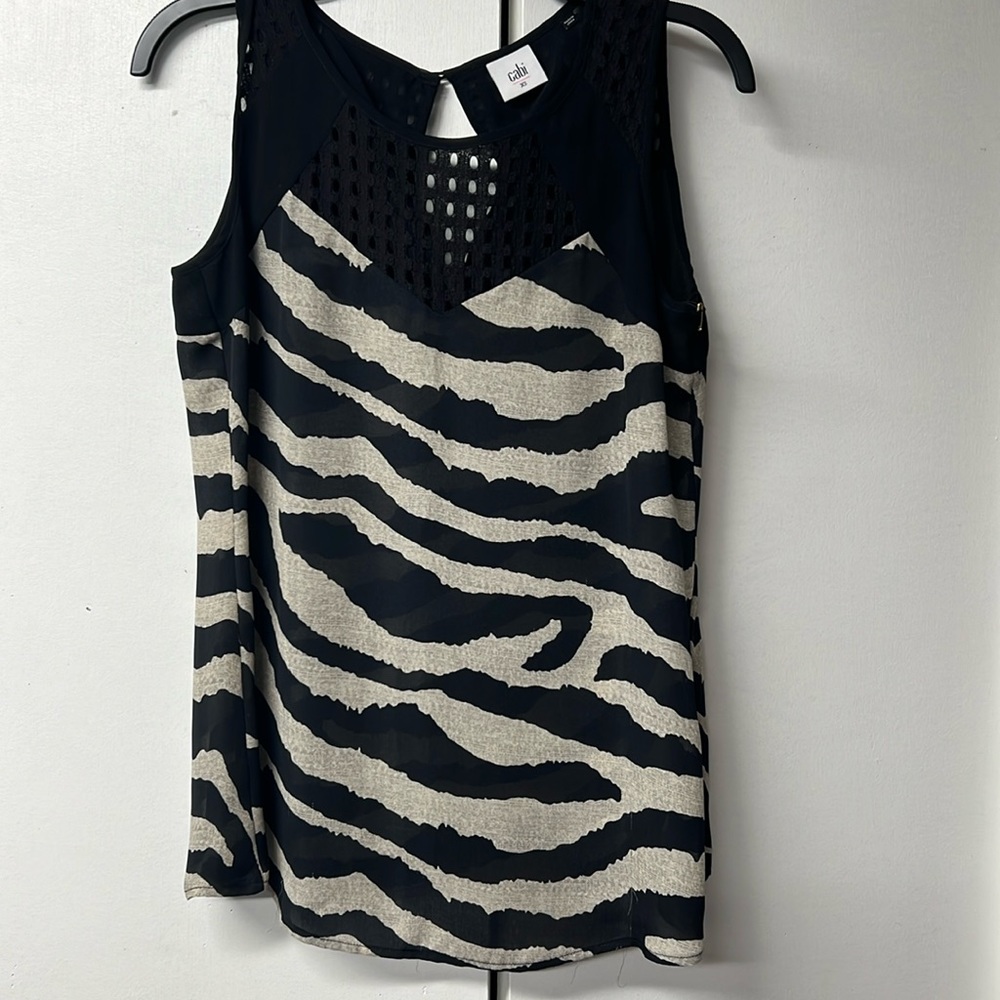 Cabi brand black and cream zebra stripe dress top with open details on top